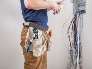 Common electrical wiring setup inside residential wall with cables and insulation