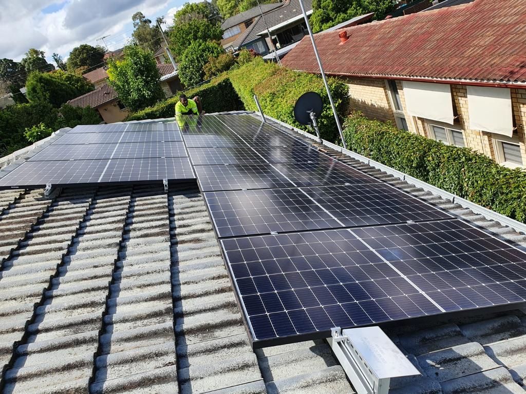 Solar panels installed on a suburban home roof generating clean electricity