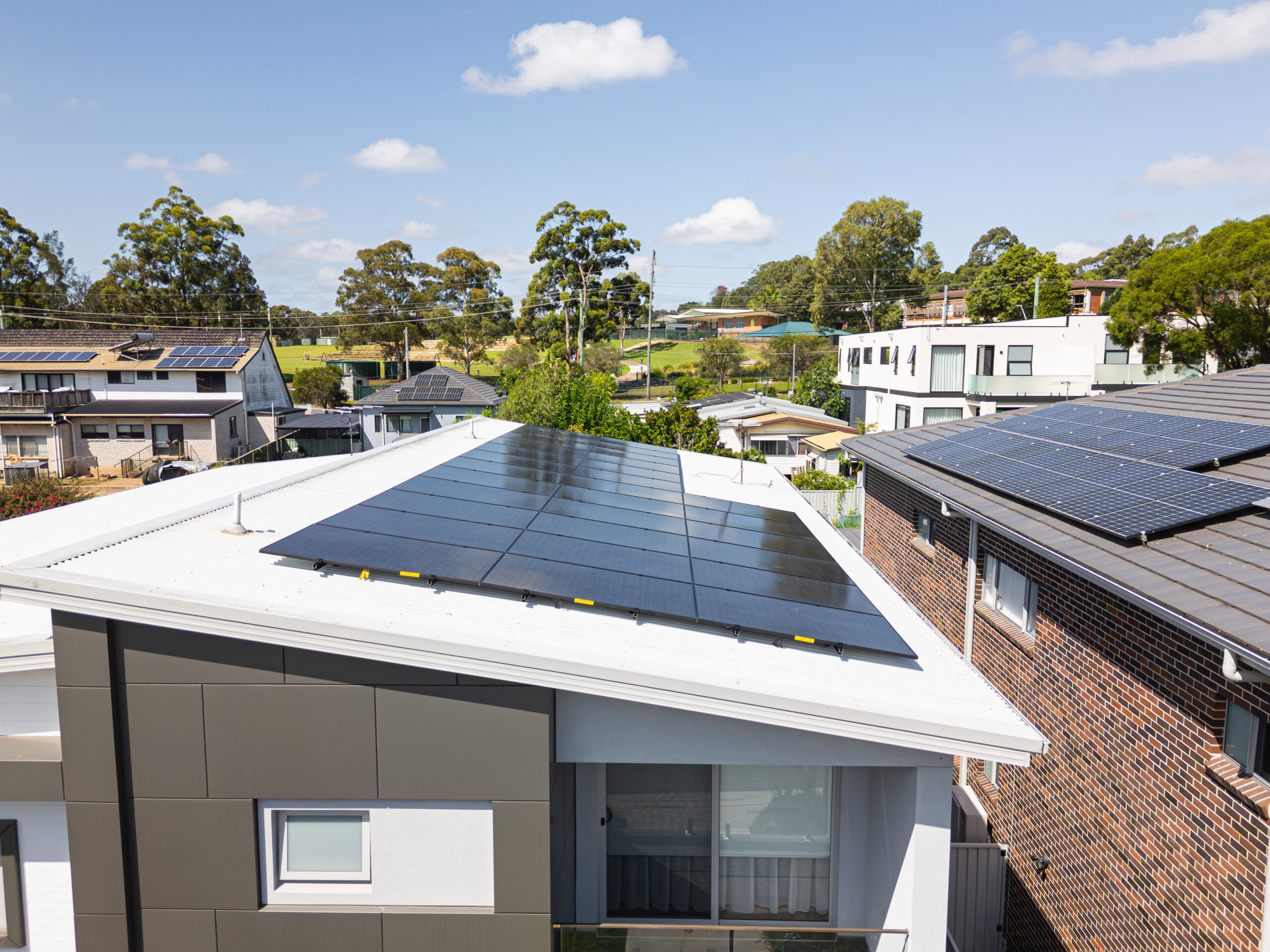 Sydney homes showcasing solar panel installations on rooftops.