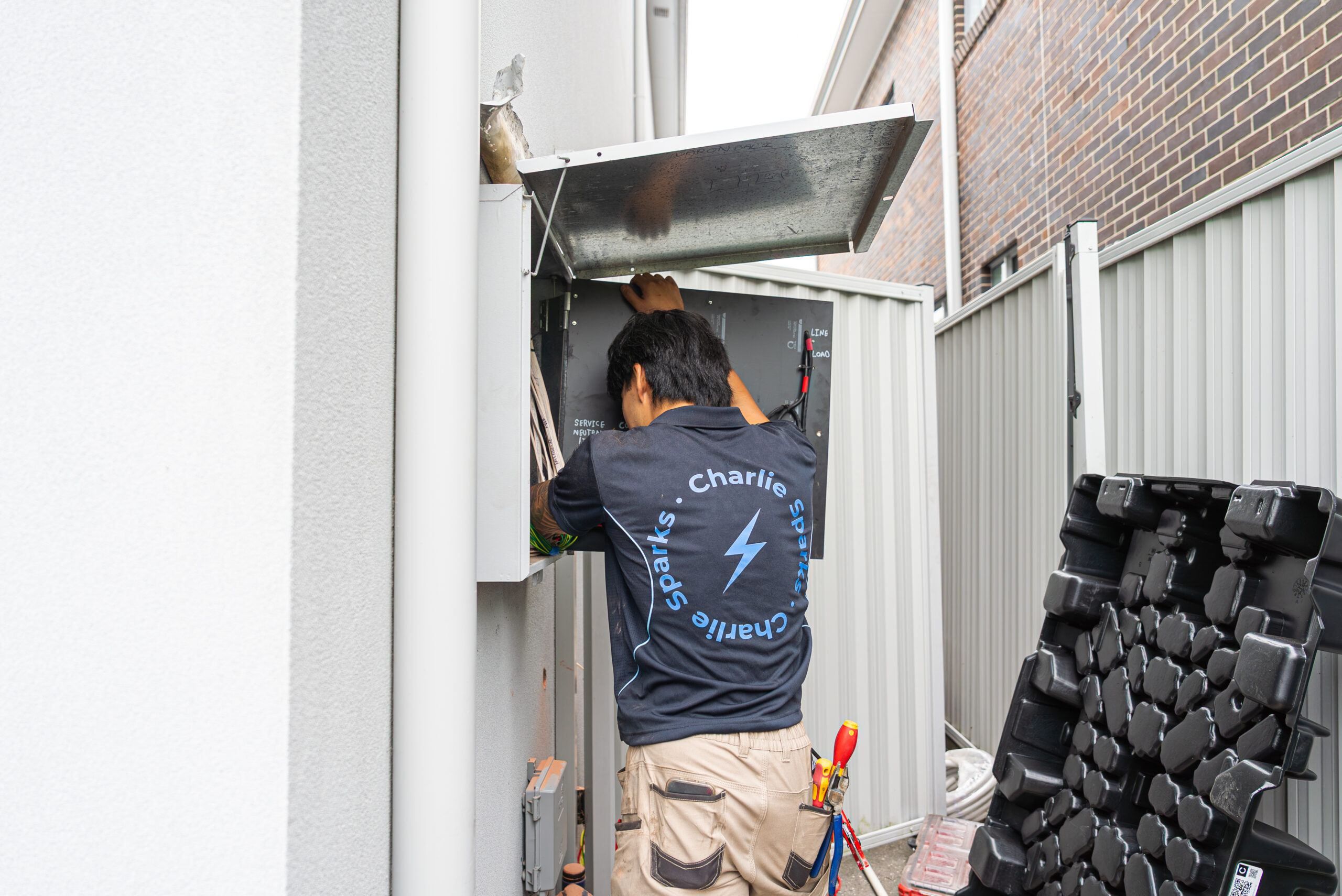 Charlie Sparks solar installer working on electrical system in Sydney.