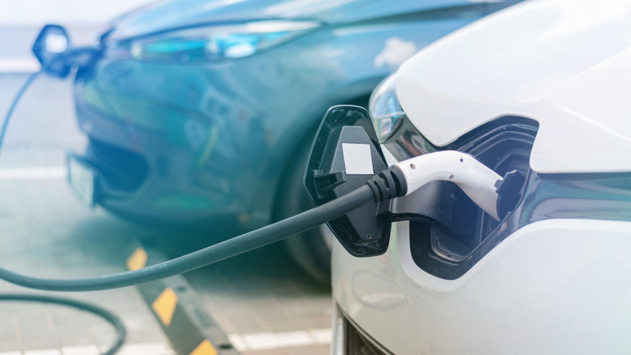 Electric cars charging at home showing the benefits of an EV charger