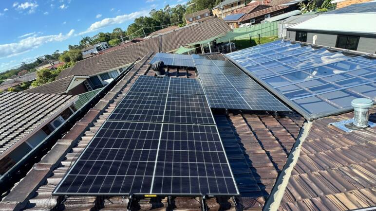 Solar panels installed on rooftops in Sydney by Charlie Sparks.