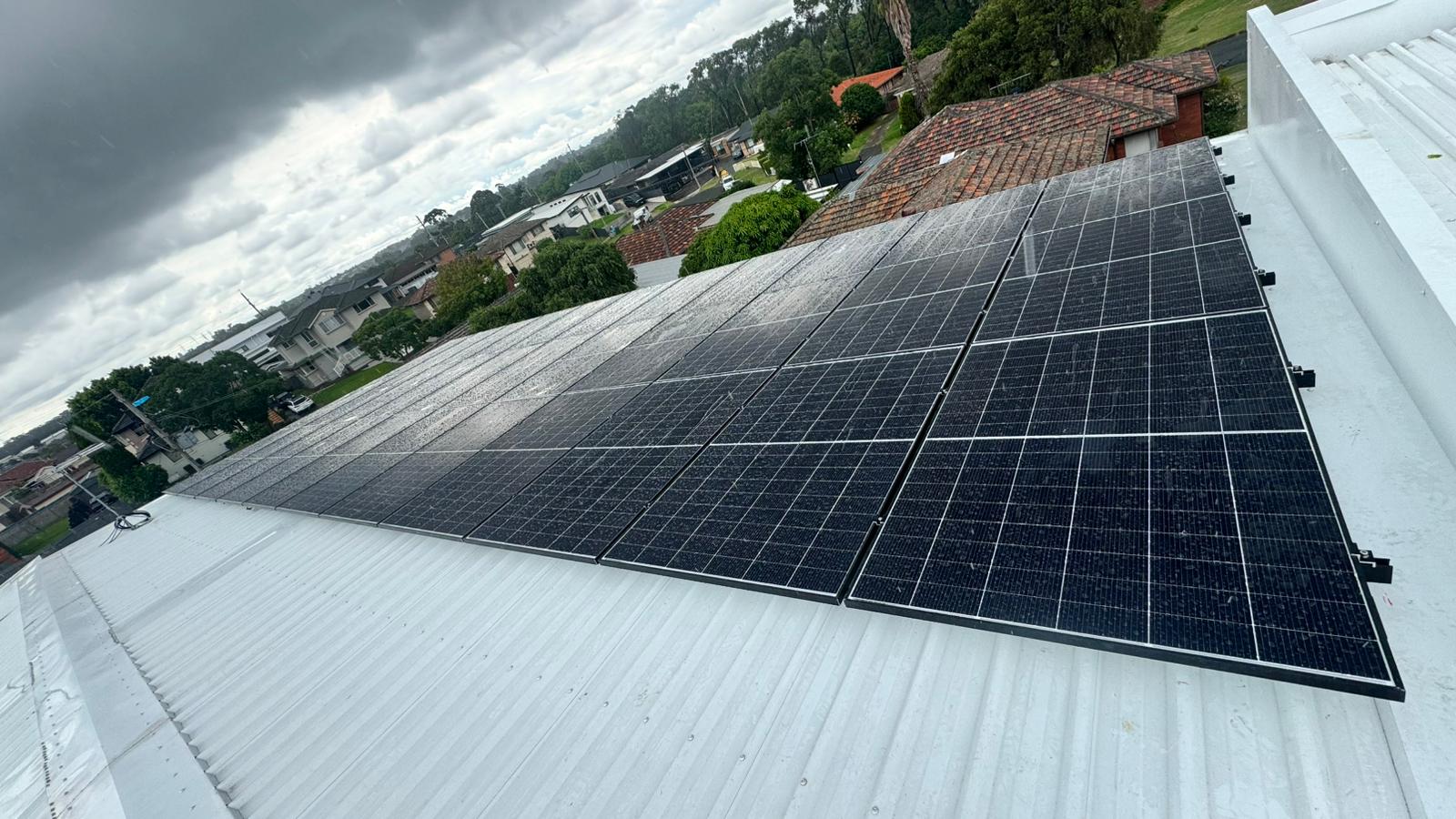 Homeowner consulting a licensed solar electrician about professional system diagnosis