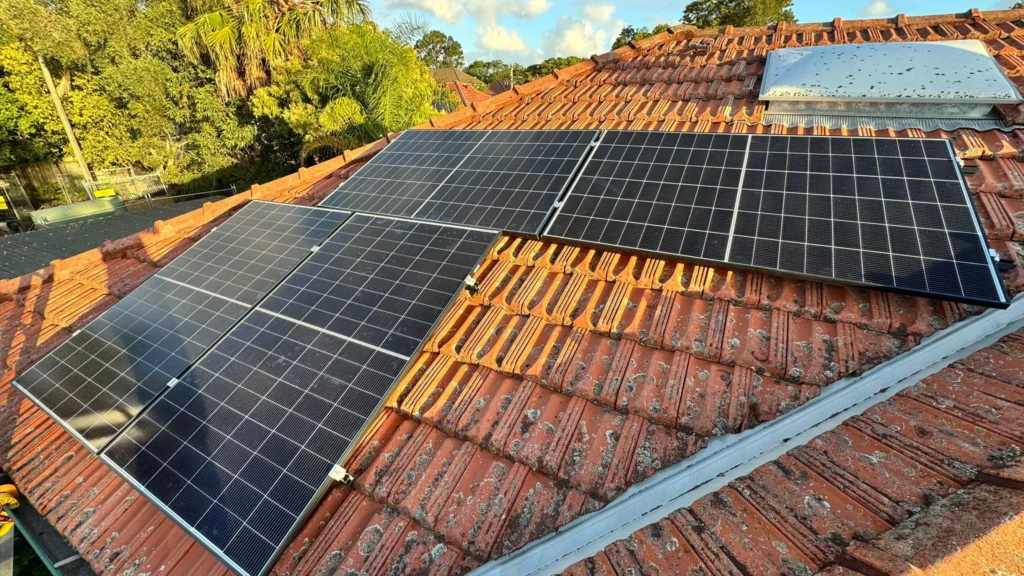 Solar panels installed on a Sydney rooftop by Charlie Sparks, harnessing solar energy.