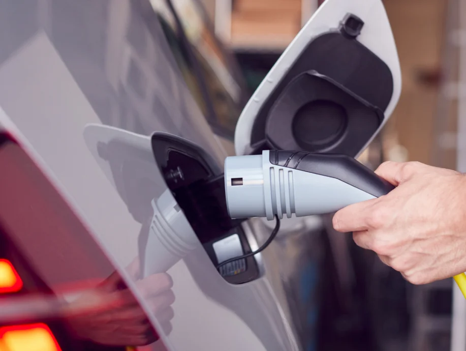 Modern Level 2 EV charger mounted on wall in home charging station setup